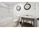 Clean bathroom with white subway tile shower, a dark wood vanity and black fixtures at 2824 Tupelo Se St, Atlanta, GA 30317