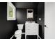 Stylish bathroom with a modern vanity and a classic toilet at 2824 Tupelo Se St, Atlanta, GA 30317