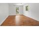 Empty bedroom with hardwood floors, bright light, and neutral walls at 2824 Tupelo Se St, Atlanta, GA 30317