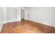 Bright and empty bedroom shows hardwood floors, neutral walls and a closet at 2824 Tupelo Se St, Atlanta, GA 30317
