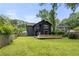 Back exterior of a house with dark siding and a well-maintained lawn at 2824 Tupelo Se St, Atlanta, GA 30317