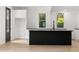 Bright kitchen featuring a black island, sleek countertops, and modern appliances at 2824 Tupelo Se St, Atlanta, GA 30317