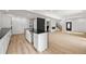 Modern kitchen boasts an island, with an open floor plan and hardwood floors at 2824 Tupelo Se St, Atlanta, GA 30317