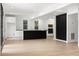 Open-concept kitchen with a black island, white cabinets, and modern finishes at 2824 Tupelo Se St, Atlanta, GA 30317