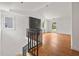 Bright and open living room space featuring wood floors, windows, and vaulted ceiling at 2824 Tupelo Se St, Atlanta, GA 30317