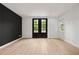 Bright living room with an accent wall and French doors at 2824 Tupelo Se St, Atlanta, GA 30317