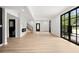 Bright living room with modern fireplace, staircase and light wood-look floors leading to bathroom at 2824 Tupelo Se St, Atlanta, GA 30317