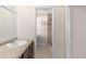 Bathroom vanity and a view to the shower area at 440 Ohern Ct, Stone Mountain, GA 30088