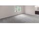 Carpeted bedroom with a window AC unit and views into another room, great for relaxation and convenience at 440 Ohern Ct, Stone Mountain, GA 30088