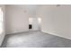Bright bedroom with a view to an ensuite bathroom and a high ceiling at 440 Ohern Ct, Stone Mountain, GA 30088