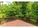 Back deck with a view to a private treed backyard at 440 Ohern Ct, Stone Mountain, GA 30088