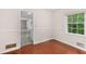 Dining area featuring hardwood floors, neutral paint, and plenty of natural light at 440 Ohern Ct, Stone Mountain, GA 30088
