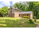 Charming brick home with a well-maintained lawn and mature trees at 440 Ohern Ct, Stone Mountain, GA 30088