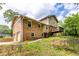Exterior view showcasing a brick facade, wooden deck, and well-maintained yard, blending charm and functionality at 440 Ohern Ct, Stone Mountain, GA 30088