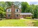 Two-story brick home featuring a well-kept lawn and a brick chimney at 440 Ohern Ct, Stone Mountain, GA 30088