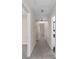 Hallway with carpet, neutral paint and doors to the bathroom and bedroom at 440 Ohern Ct, Stone Mountain, GA 30088