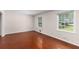 Inviting living room with windows offering ample natural light and gleaming wood floors at 440 Ohern Ct, Stone Mountain, GA 30088