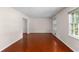 Open concept living room featuring hardwood floors and neutral paint, a welcoming atmosphere at 440 Ohern Ct, Stone Mountain, GA 30088