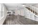 Bright living room with hardwood floors, built-in shelving and stairs at 440 Ohern Ct, Stone Mountain, GA 30088