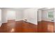 Bright living room with hardwood floors and neutral paint, offering a clean and inviting space at 440 Ohern Ct, Stone Mountain, GA 30088
