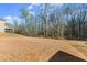 Home featuring a large backyard with beautiful trees at 485 St Annes Pl, Covington, GA 30016