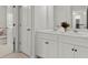 Bathroom featuring a double sink vanity, white cabinets, and modern fixtures at 485 St Annes Pl, Covington, GA 30016