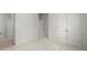 Neutral bedroom featuring a large closet space, carpet, and bright window light at 485 St Annes Pl, Covington, GA 30016