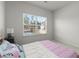 Bedroom featuring a queen-size bed and a large window that provides plenty of natural light at 485 St Annes Pl, Covington, GA 30016