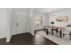 Dining room with modern chandelier, wainscoting, bright lighting and a large window at 485 St Annes Pl, Covington, GA 30016