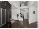 Bright foyer featuring dark wood flooring, staircase with iron railing and neutral paint at 485 St Annes Pl, Covington, GA 30016