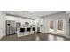 Modern kitchen with stainless steel appliances, a large island with seating, and abundant natural light from the adjacent dining area at 485 St Annes Pl, Covington, GA 30016
