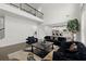 Spacious living room featuring high ceilings, a cozy seating area with a modern fireplace and view of the kitchen at 485 St Annes Pl, Covington, GA 30016