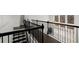 Staircase with modern wrought iron railing and hardwood treads at 485 St Annes Pl, Covington, GA 30016