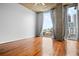 Sun-drenched bedroom featuring wood floors, cityscape views, and natural light at 860 Peachtree Ne St # 909, Atlanta, GA 30308