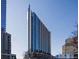 Modern high-rise building with sleek architecture and a view of the surrounding cityscape at 860 Peachtree Ne St # 909, Atlanta, GA 30308
