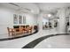 Beautiful building lobby with modern decor, featuring a dining area, lounge area, and terrazzo floors at 860 Peachtree Ne St # 909, Atlanta, GA 30308