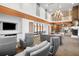 Spacious lounge area with comfortable seating, a TV, and a fireplace, offering a welcoming space for relaxation and entertainment at 860 Peachtree Ne St # 909, Atlanta, GA 30308