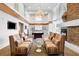 Inviting lounge area with comfortable seating, a stone fireplace, and abundant natural light from large windows at 860 Peachtree Ne St # 909, Atlanta, GA 30308