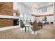 This cozy lounge area features comfortable seating and a stone fireplace, perfect for relaxing and unwinding at 860 Peachtree Ne St # 909, Atlanta, GA 30308