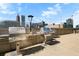 This outdoor grill area features stainless steel grills and cityscape views, perfect for entertaining guests at 860 Peachtree Ne St # 909, Atlanta, GA 30308