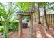 Charming backyard arbor with landscaping, creating a peaceful garden retreat at 3125 Flatbottom Dr, Dacula, GA 30019