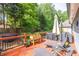 Well-maintained back deck features lounge chairs, grill, and a nice view at 3125 Flatbottom Dr, Dacula, GA 30019