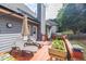 Relaxing back deck with lounge chairs and an umbrella provides a cozy outdoor retreat at 3125 Flatbottom Dr, Dacula, GA 30019