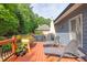 Back deck with a grill and lounge seating for outdoor entertaining at 3125 Flatbottom Dr, Dacula, GA 30019