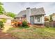 Landscaped backyard featuring a deck, mature trees, and a well-maintained lawn at 3125 Flatbottom Dr, Dacula, GA 30019
