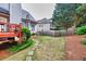 Fenced backyard with lush greenery and a stone pathway leading to the deck at 3125 Flatbottom Dr, Dacula, GA 30019
