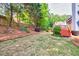 Spacious backyard with grass, a wooden fence, and an inviting outdoor space at 3125 Flatbottom Dr, Dacula, GA 30019