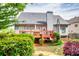 Well-maintained backyard with wooden deck, mature landscaping, and privacy at 3125 Flatbottom Dr, Dacula, GA 30019