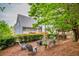 Spacious backyard with a firepit, arbor, landscaping, and a private setting at 3125 Flatbottom Dr, Dacula, GA 30019