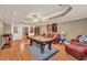 Spacious finished basement featuring a pool table and comfortable seating at 3125 Flatbottom Dr, Dacula, GA 30019